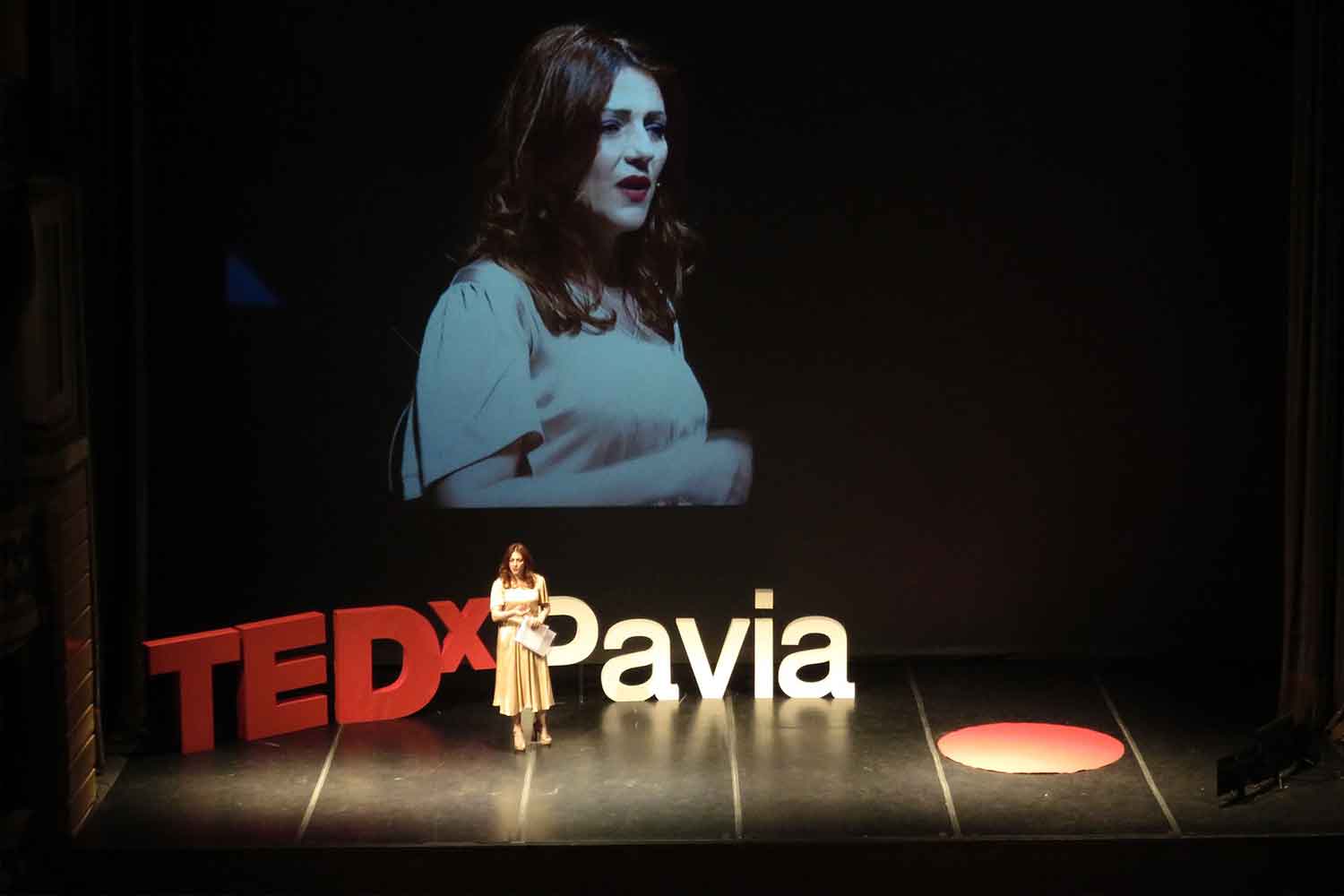 woman speaking at tedx pavia